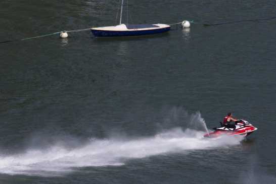15 July 2021 - 15-06-10
Two jet skiers, gathered with some friends near the Lower Ferry decided to race out. The noise was incredible. The speed even more so. By far the fastest thing I have seen on the river. Faster than the lifeboat, any BRNC rib or a Dart Harbour patrol.
-------------------
Racing jet skiers in Dartmouth harbour